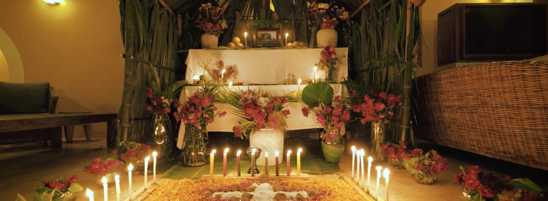 A altar with flowers and candles during Hanal Pixán, Yucatan’s Day of the Dead in Mexico at Hacienda Xcanatun, Angsana Heritage Collection