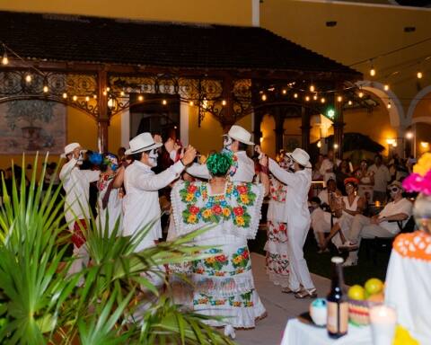 A group of people wearing white and colourful clothing dancing to celebrate Hanal Pixán, Yucatan's version of the Day of the Dead festival, Hacienda Xcanatun, Angsana Heritage Collection