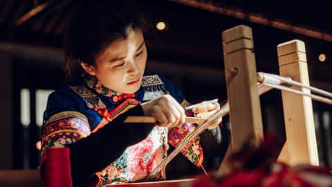 A woman doing traditional craft at Banyan Tree Anji
